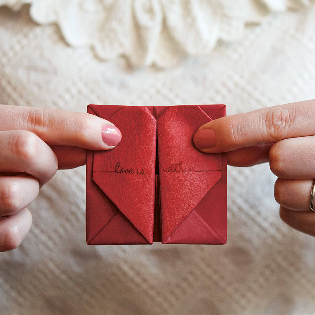 Close up folded origami paper heart keepsake.